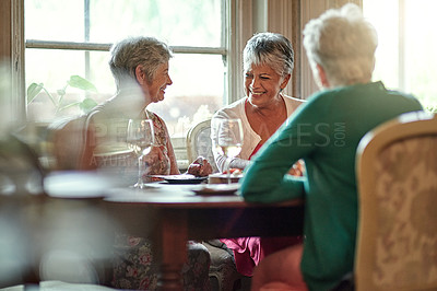 Buy stock photo Cropped shot of a group of senior female friends enjoying a lunch date