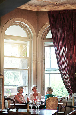 Buy stock photo Cropped shot of a group of senior female friends enjoying a lunch date