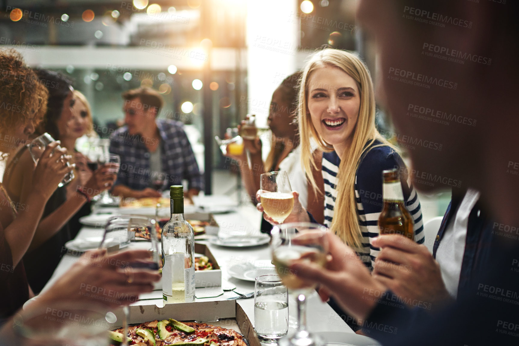 Buy stock photo Pizza, friends and happy restaurant party for dinner hangout, celebration and wellness. Reunion, happiness and interracial friendship of people enjoying pizzeria food and wine together.

