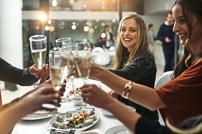 Buy stock photo Shot of friends having a dinner party at a restaurant