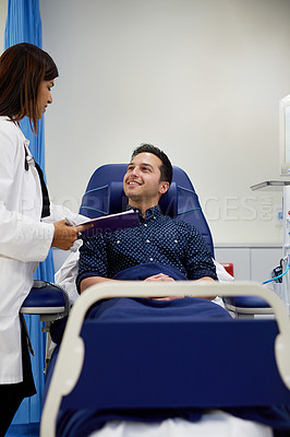 Buy stock photo Shot of a doctor attending to a patient in a hospital