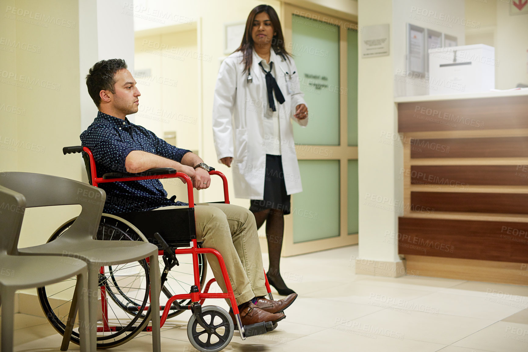 Buy stock photo Shot of a man sitting in a wheelchair in a hospital