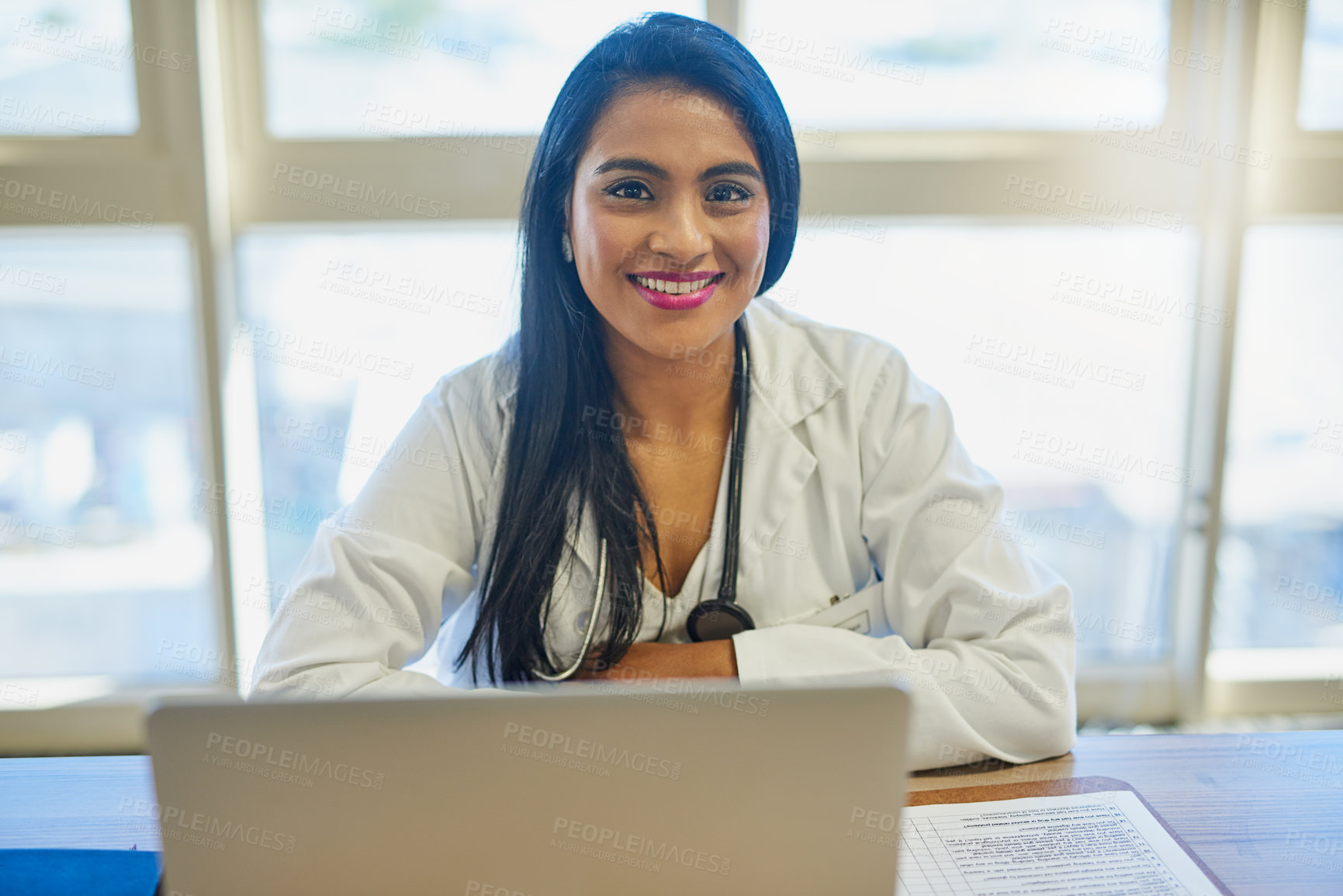Buy stock photo Portrait of a female doctor working on a laptop in her office