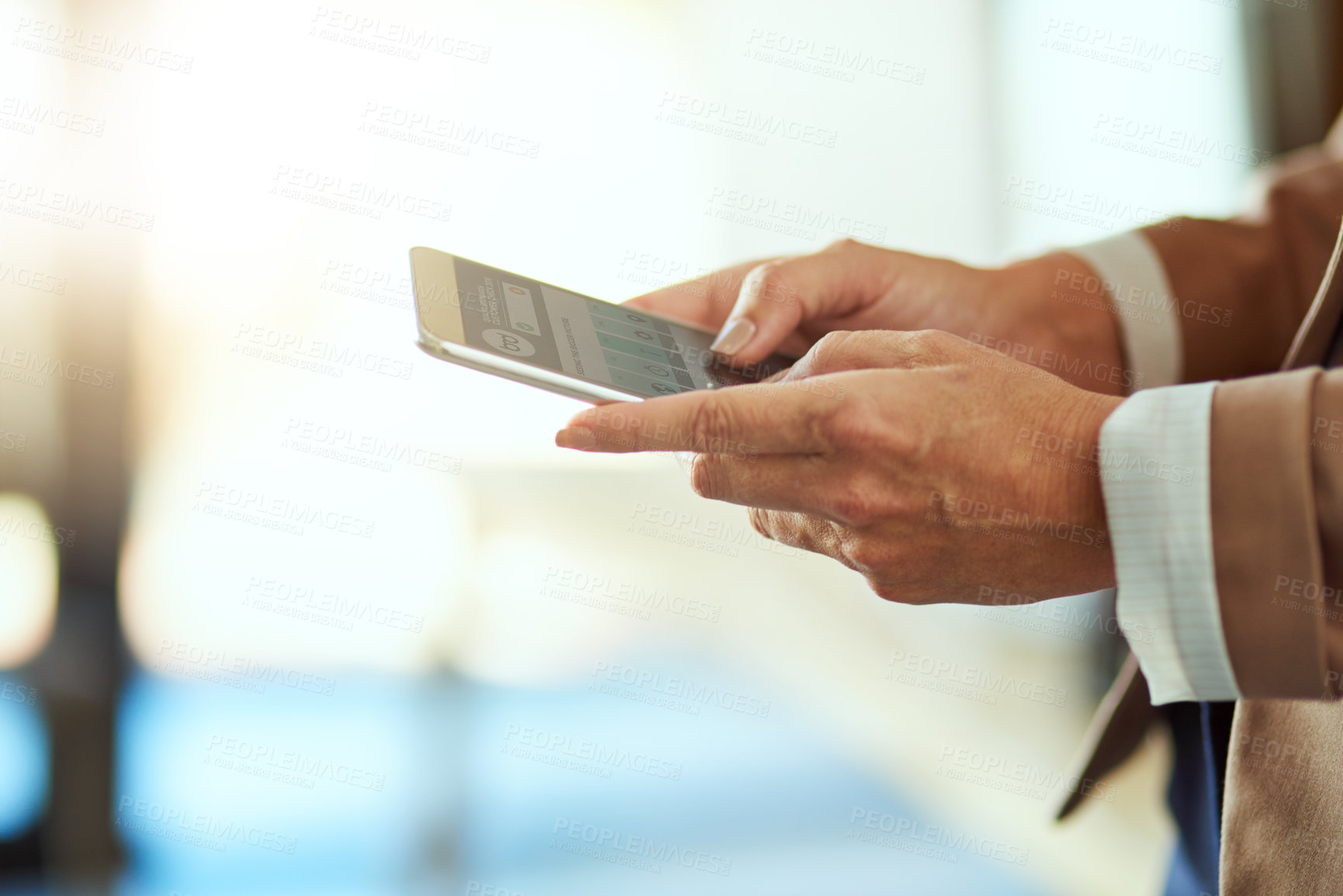 Buy stock photo Closeup shot of an unrecognisable businesswoman using a cellphone in an office