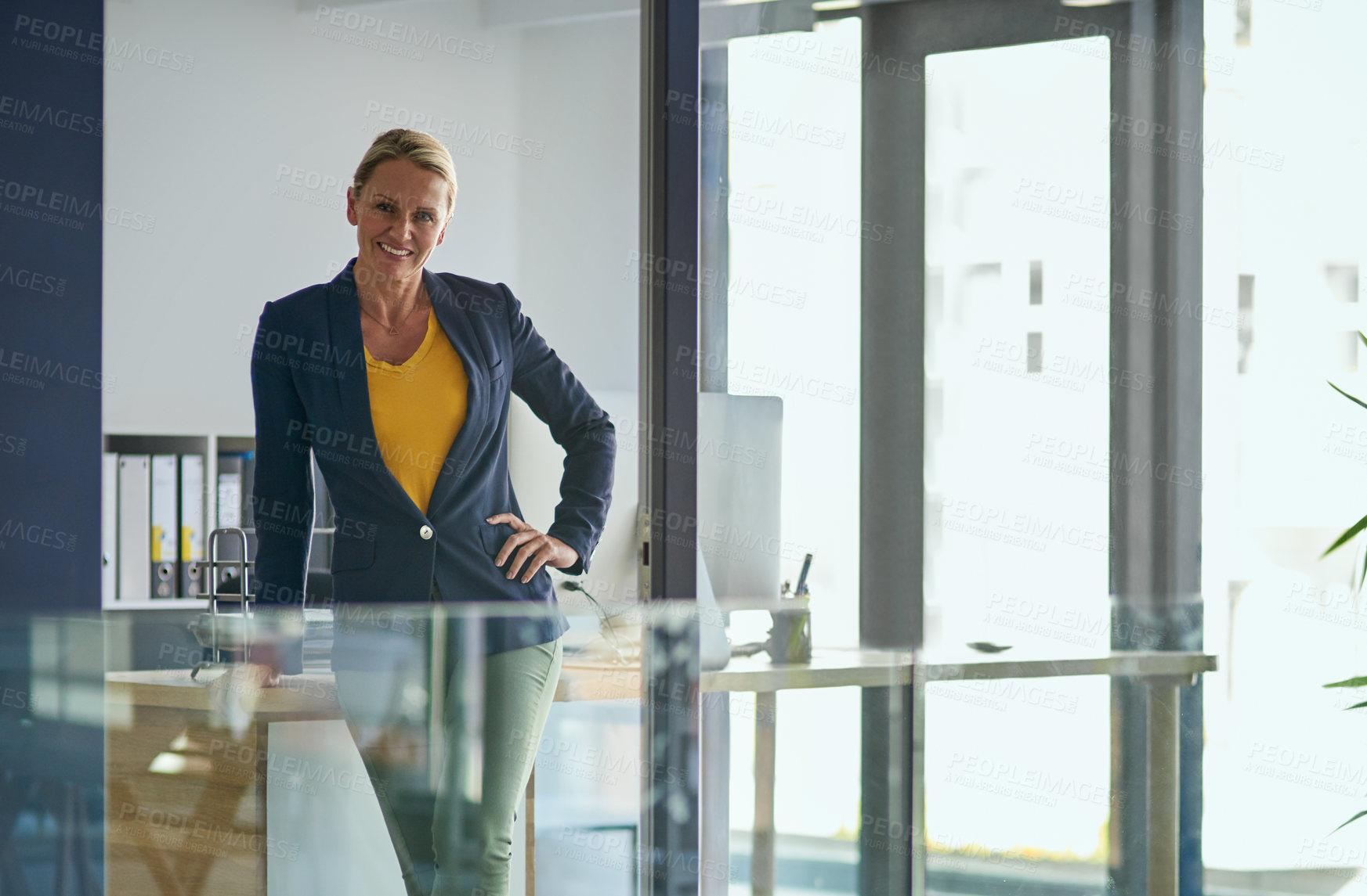 Buy stock photo Portrait of a mature businesswoman standing in an office