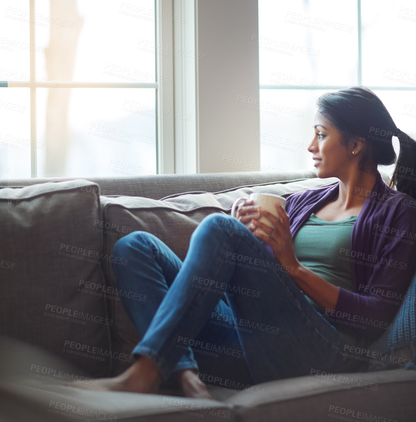 Buy stock photo Thinking, relax and Indian woman drinking coffee in home living room for morning beverage, latte or espresso. Tea, dream and girl on sofa for peace, calm and planning future in comfortable house