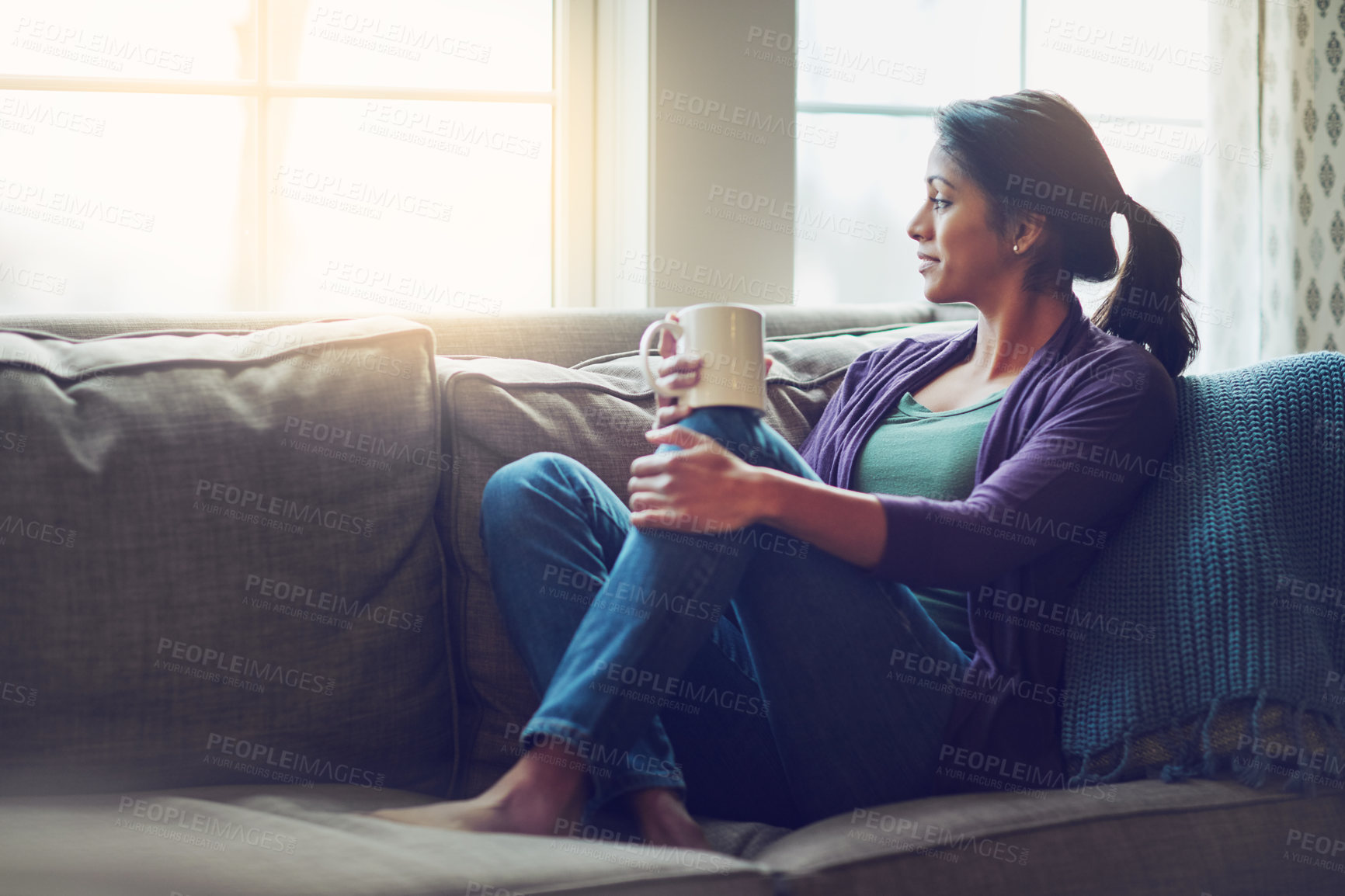 Buy stock photo Thinking, dream and Indian woman drinking coffee in home living room for morning breakfast, latte or espresso. Tea, relax and person on sofa for peace, calm and planning future in comfortable house