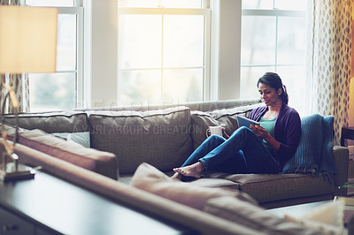 Buy stock photo Woman, house and reading tablet for relax on couch, scroll on internet or social media. Female person, mobile technology or living room with research and happiness, online blog or email communication