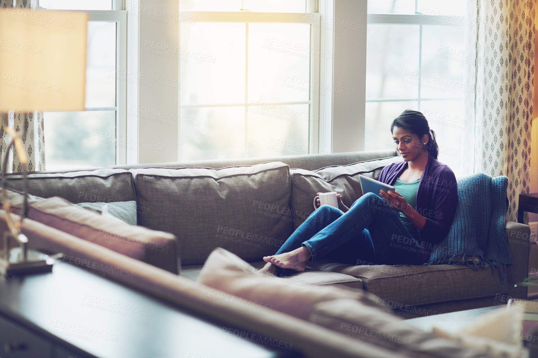 Buy stock photo Woman, house and reading tablet for relax on couch, scroll on internet or social media. Female person, mobile technology or living room with research and happiness, online blog or email communication