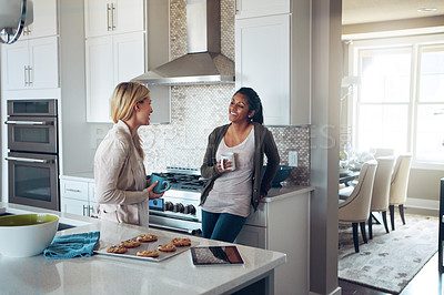 Buy stock photo Coffee, morning and relax with friends in kitchen of home together for bonding or breakfast. Conversation, smile and women with happy roommate people drinking tea in apartment for break or chatting