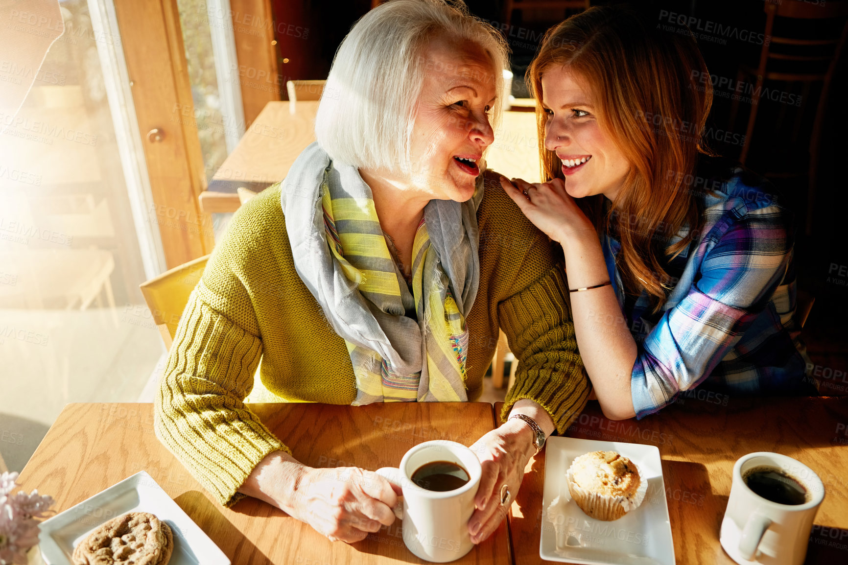 Buy stock photo Senior woman, laughing and daughter with happy in cafe for memories or bonding with relax. Restaurant, coffee shop and discussion with people, conversation and family smiling with love in France.