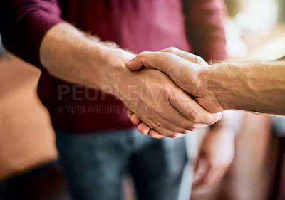 Buy stock photo Closeup of two unrecognizable people's hands greeting and shaking hands inside of a office at work