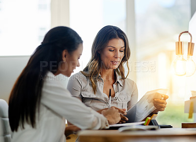Buy stock photo Business women, file and talking for partnership, planning and paperwork in office together. Woman, teamwork and focus with documents, notes or schedule at job for collaboration, consulting or advice