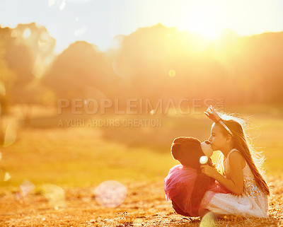 Buy stock photo Playing, kiss or girl with teddy bear in park for love, orphan or toy for support, care or therapy healing. Relax, nature or kid on grass field with stuffed animal, princess costume or donation gift