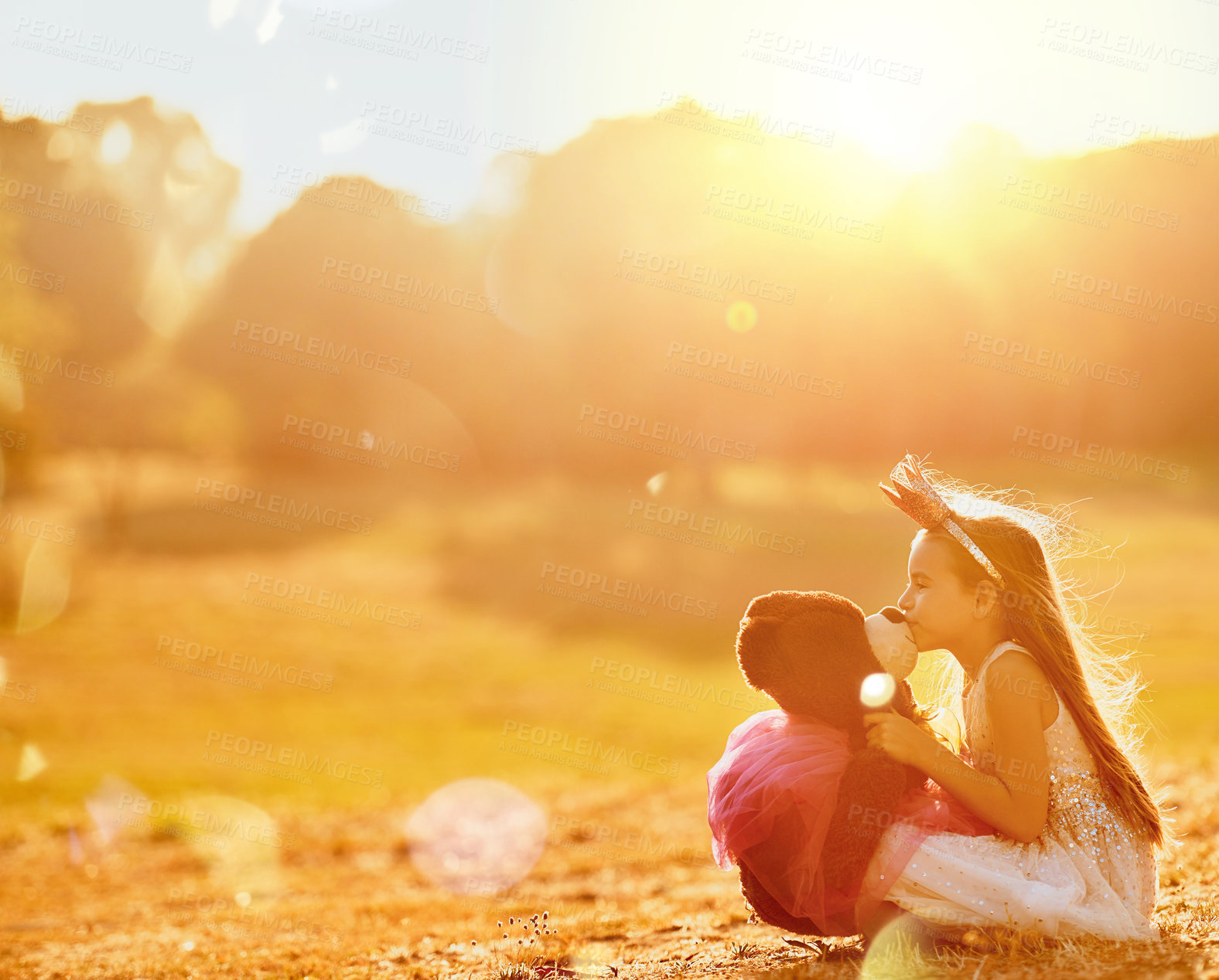 Buy stock photo Playing, kiss or girl with teddy bear in park for love, orphan or toy for support, care or therapy healing. Relax, nature or kid on grass field with stuffed animal, princess costume or donation gift