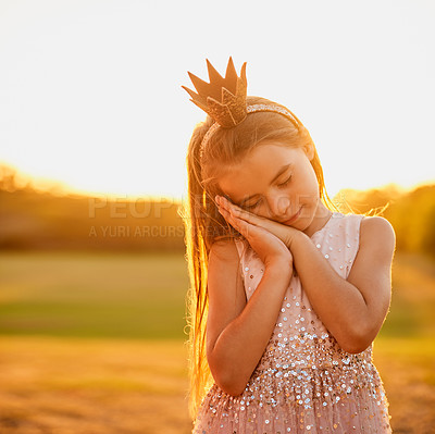 Buy stock photo Girl, crown and sleeping in nature for dream, fantasy and glitter for fairytale themed birthday party. Child, princess and peace in field for play time, adventure and dress up at sunset in Australia