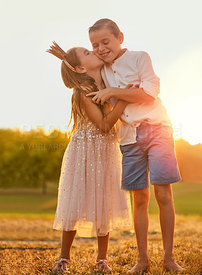 Buy stock photo Children, hug and outdoor kiss in nature, brother and sister bonding on holiday field for love. Kids, siblings and sunset for adventure games on vacation, care and embrace for trust in relationship