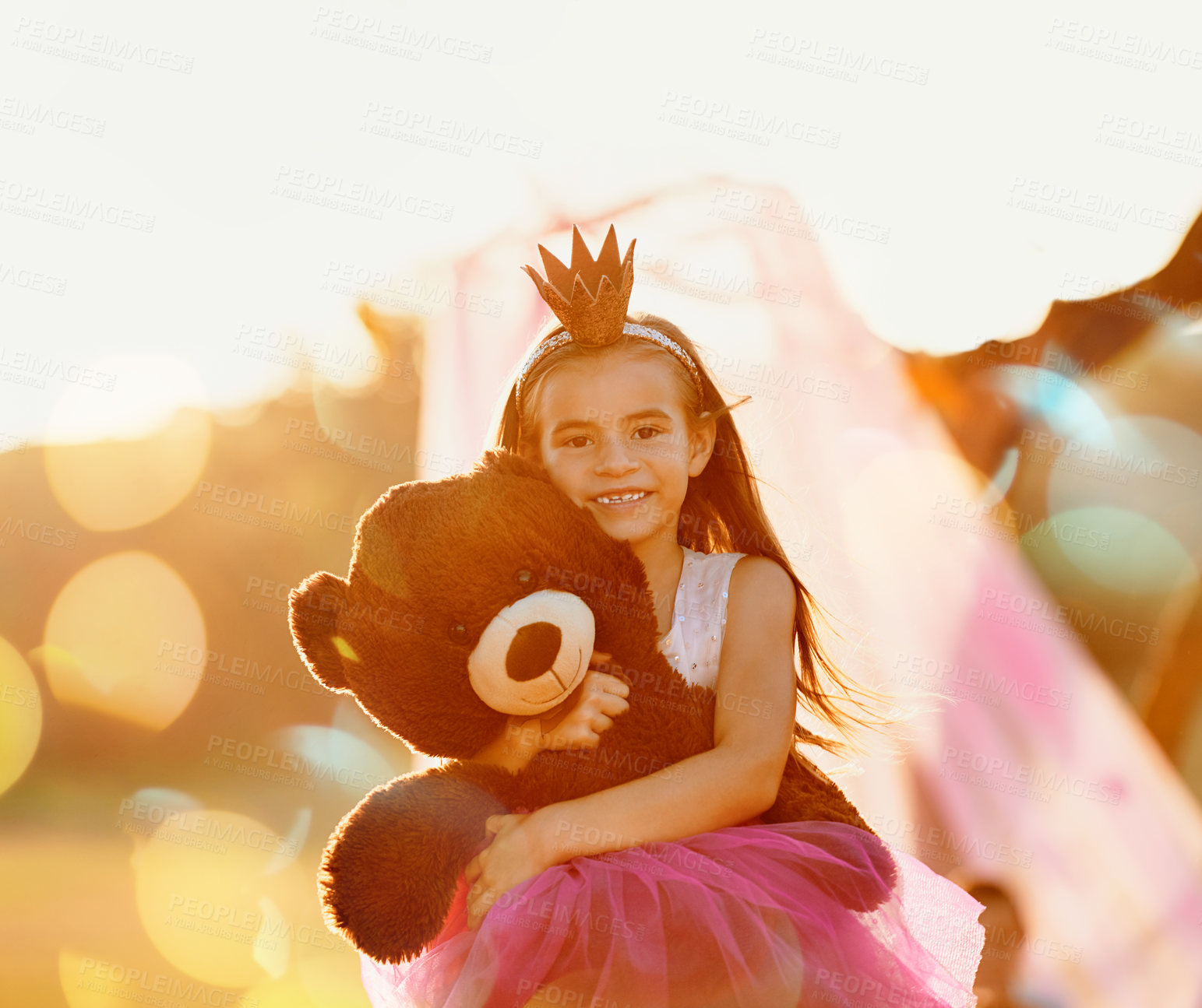 Buy stock photo Portrait, princess or girl with teddy bear in park for love, orphan or toy for support, care or therapy healing. Hug, tiara or kid in nature with stuffed animal, costume and donation gift in Spain