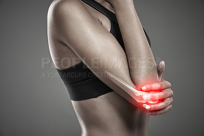 Buy stock photo Woman, arm pain and athlete for injury in studio, training accident and red glow on gray background. Female person, sports and joint arthritis or risk of fibromyalgia, elbow and inflammation x ray