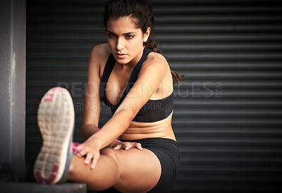 Buy stock photo Woman, exercise and stretching legs in gym warehouse for fitness, sports and physical activity. Female person, workout and muscle warm up for training, health and running performance as athlete