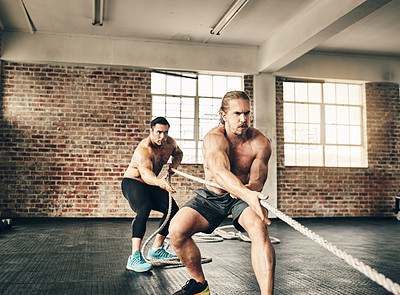 Buy stock photo Man, friends and pulling rope for fitness as gym partners or bodybuilder with strength and determination. People, muscles and strong on training, workout and exercise for health and self care