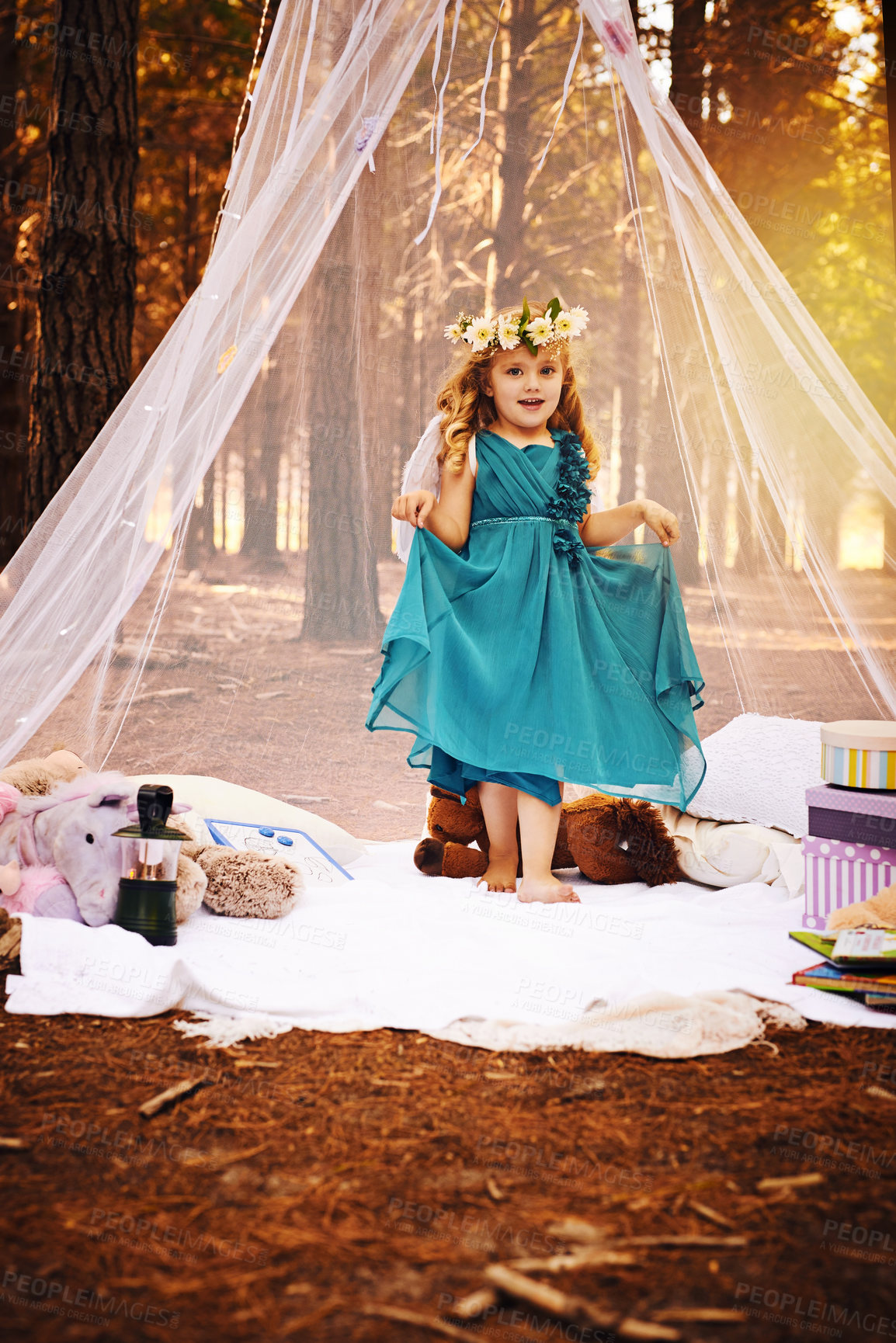 Buy stock photo Girl child, princess and portrait in nature for fantasy, themed birthday party and dress up for picnic. Kid, smile and blanket in woods with toys for play, freedom and flower crown for aesthetic