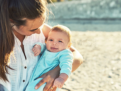 Buy stock photo Shot of a young Mother and son spending quality time at the beach