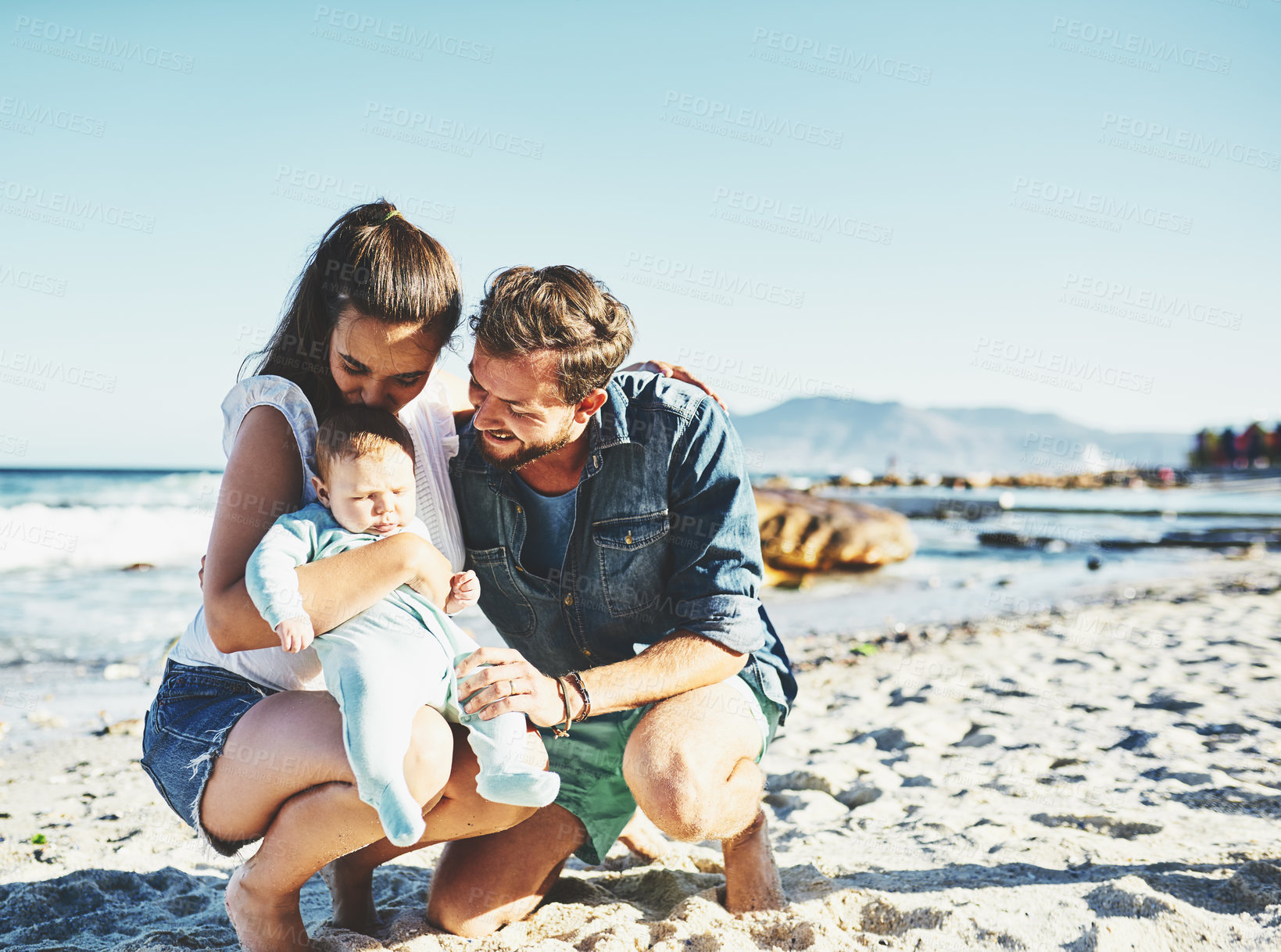 Buy stock photo Dad, mom or baby at sea for happy family, holiday or travel in Portugal with boy or bonding. Parents, mother or father with infant at beach for vacation trip together for wellness or love to relax