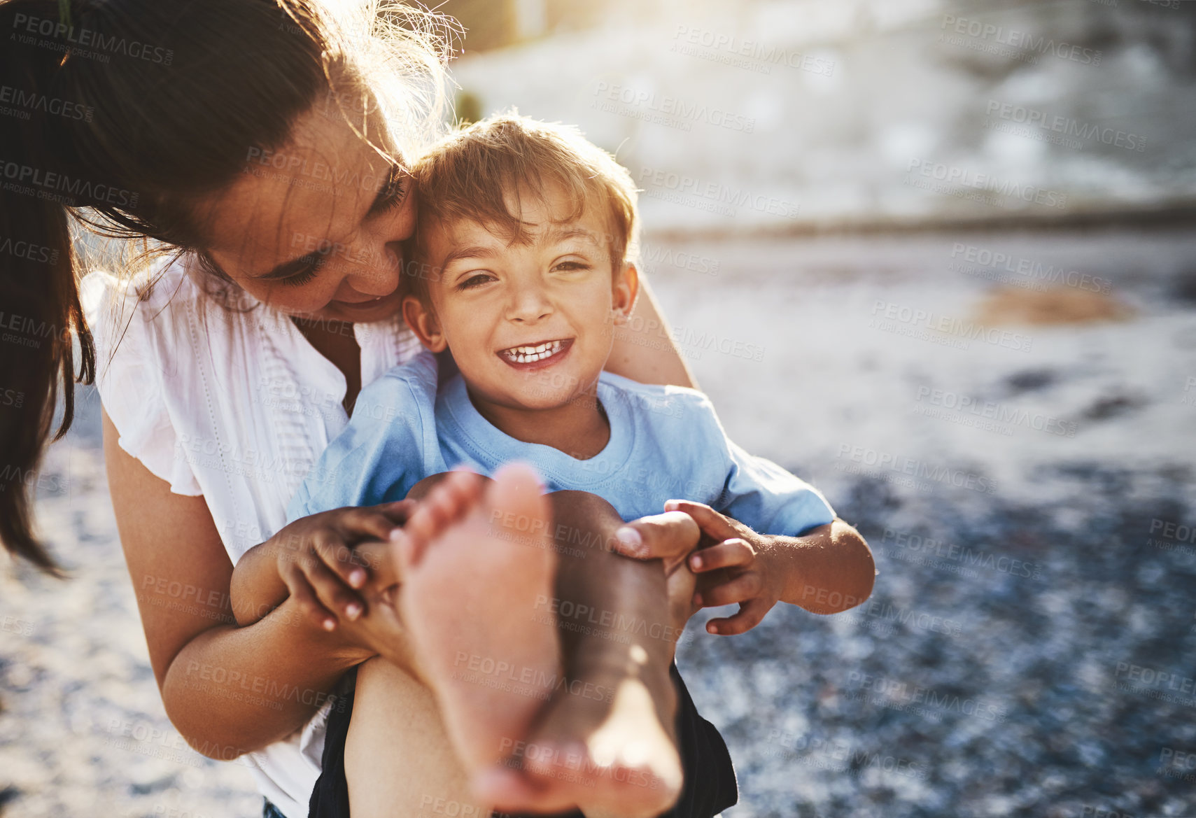 Buy stock photo Mom, child and beach fun with smile, hug and laughing by the sea with love, care and bonding. Vacation, holiday and travel outdoor with parent and boy by the ocean with summer and trip together