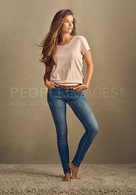 Buy stock photo Studio shot of a beautiful young woman posing in the studio