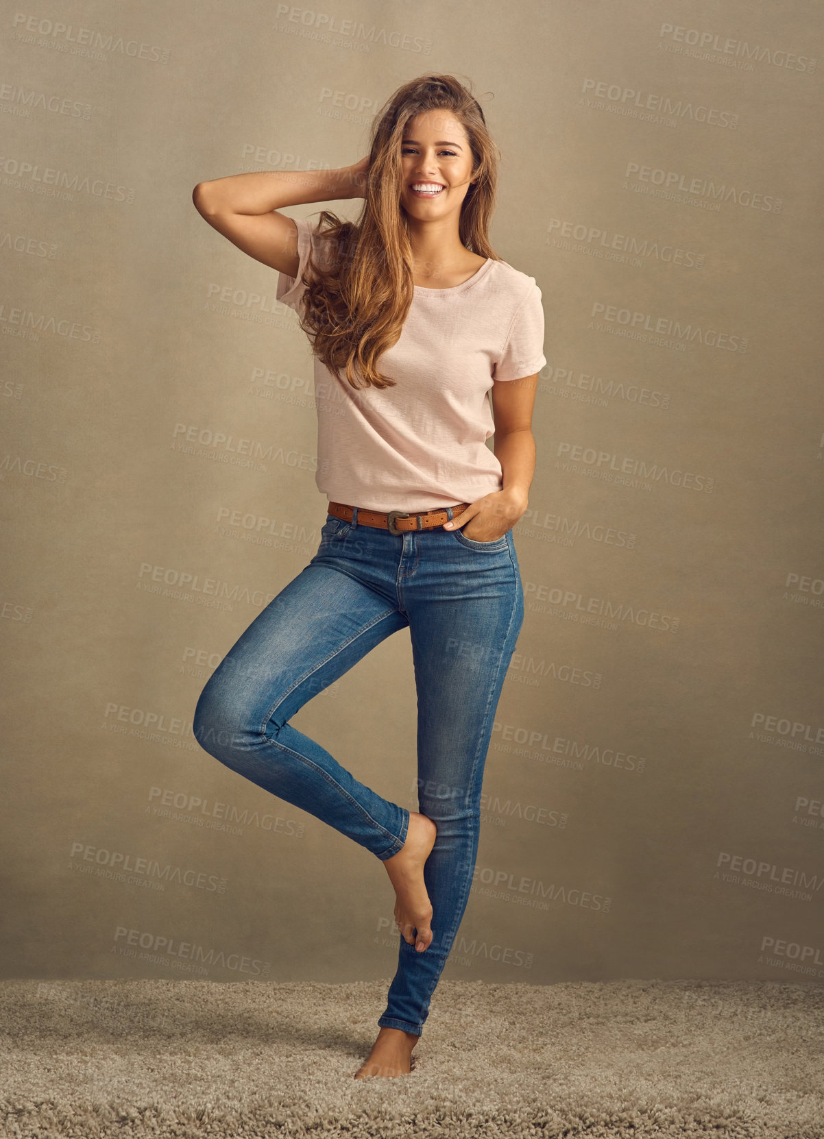 Buy stock photo Portrait, woman and hair care or fashion in studio with confidence for style or cosmetics. Beauty, model girl and happy for shampoo, treatment and denim or jeans for trendy outfit by brown background