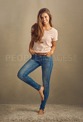 Buy stock photo Portrait, fashion and woman with smile, funny and happiness on studio background. Mockup space, cheerful person and model with humor, trendy clothes and casual style with jeans, pride and confidence