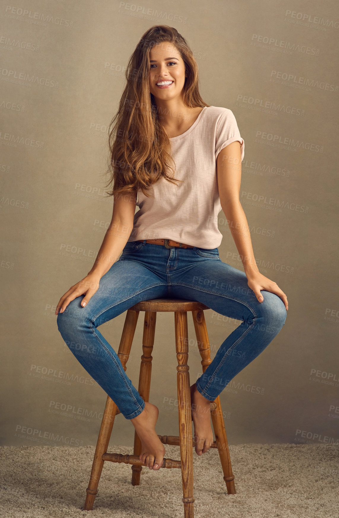 Buy stock photo Studio background, smile and portrait of woman on chair for trendy style, cool and fashion. Happy, female person and relax with barefoot on stool for stylish clothes, positivity and confidence