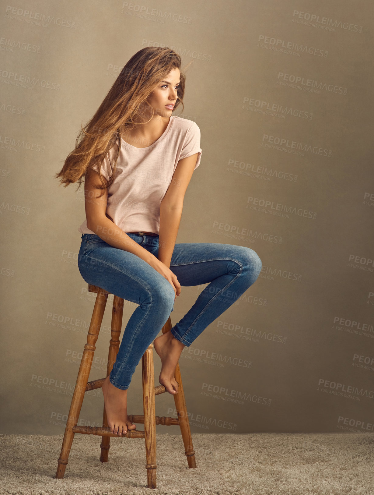 Buy stock photo Studio background, smile and woman with thinking on chair for cool style, trendy and fashion. Female person, relax and barefoot with idea on stool for comfortable clothes, vision and confidence