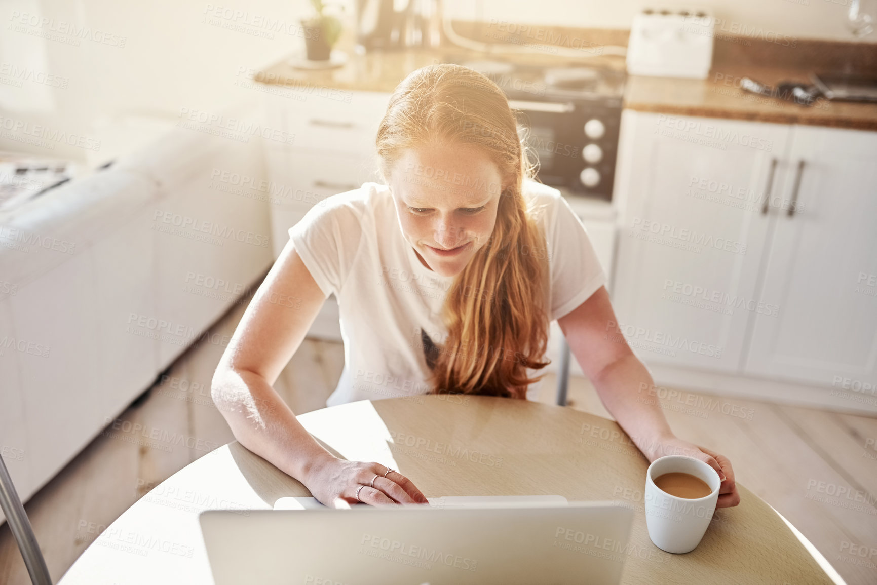 Buy stock photo Happy, woman and laptop in morning for social media, networking and online app in kitchen. Technology, female person and relax in home for communication, internet and coffee or website for connection