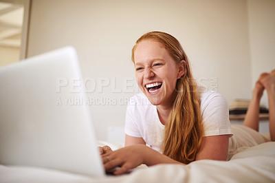Buy stock photo Shot of a young woman laying in bed at home