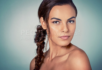 Buy stock photo Studio shot of a beautiful young woman posing against a green background