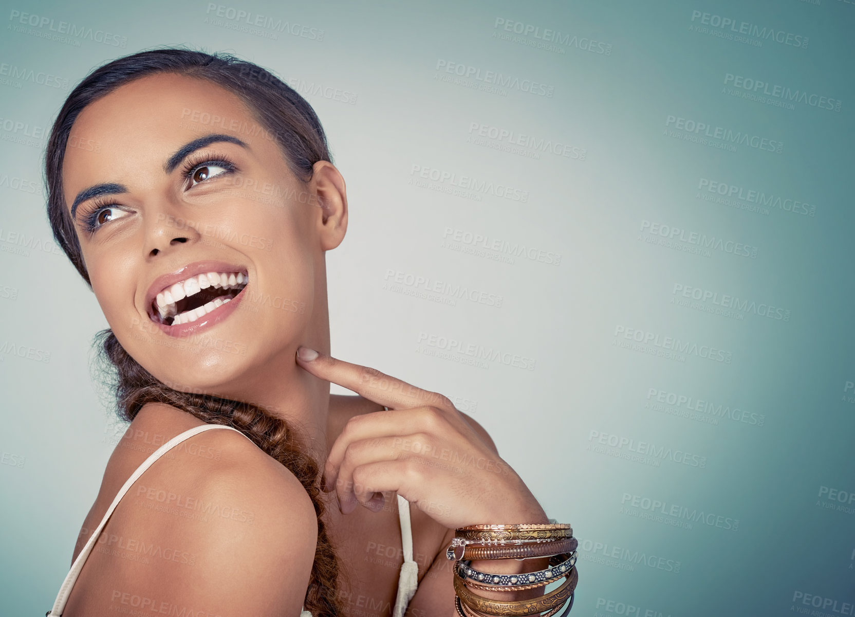 Buy stock photo Thinking, mockup or girl with beauty or skincare on blue background for shine, bangles or natural glow. Model, face or happy woman in studio for dermatology space, smooth results or facial health