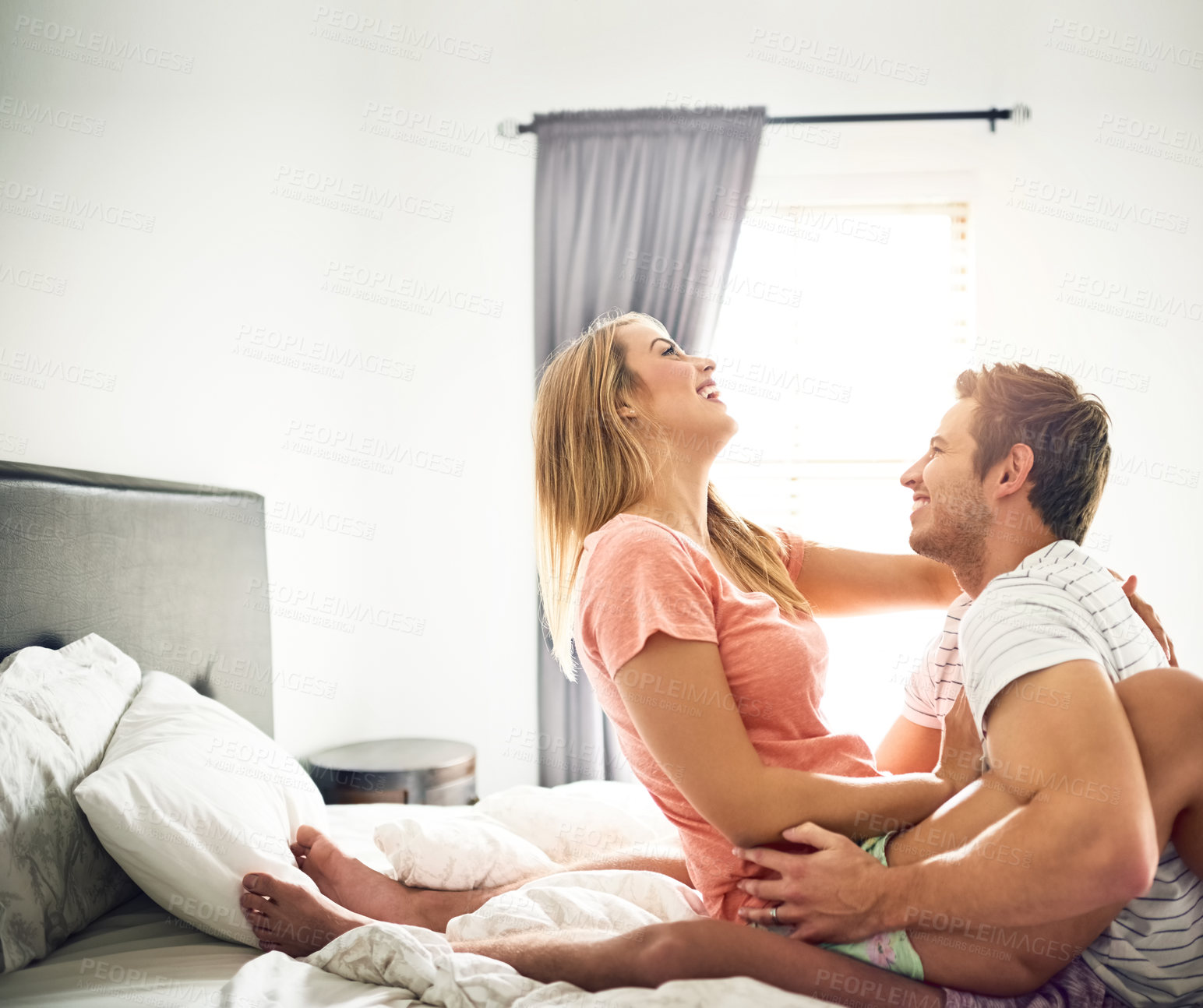 Buy stock photo Love, cuddle and marriage with couple in bedroom for romance, bonding or happiness. Honeymoon, getaway and house rental with man and woman on holiday or staycation for anniversary retreat and wake up