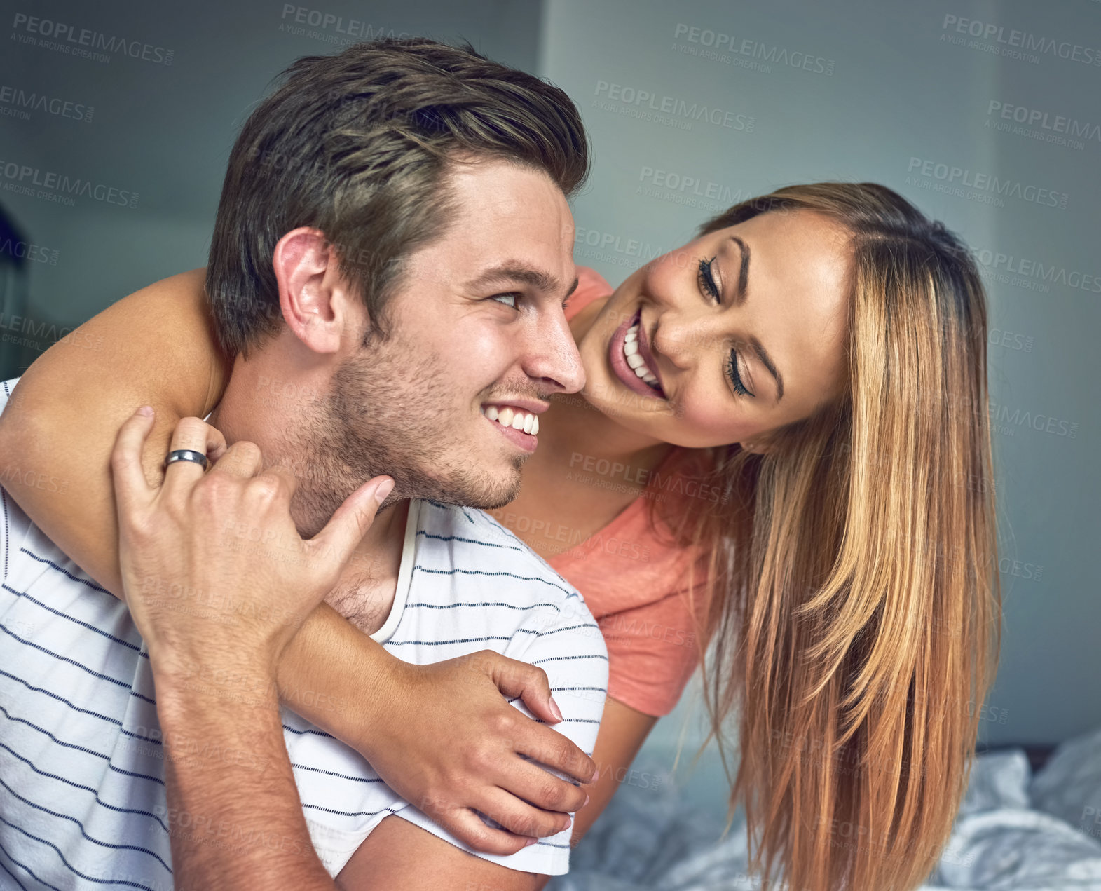 Buy stock photo Love, hug and relationship with couple in bedroom for romance, bonding and marriage. Honeymoon, getaway and house rental with man and woman on holiday or staycation for anniversary retreat together