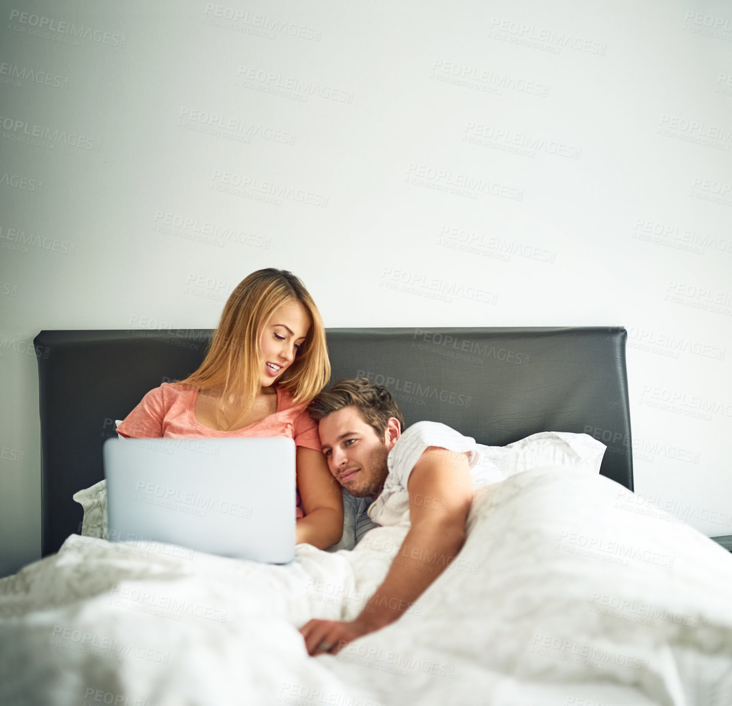 Buy stock photo Laptop, love and relax with couple in bedroom of home together for morning bonding or romance. Happy, streaming or wellness with man and woman on bed in apartment for holiday, hospitality or vacation