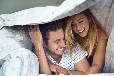 Buy stock photo Love, laughing and blanket with couple in bedroom for romance, bonding or marriage. Honeymoon, getaway and house rental with man and woman on holiday or staycation for anniversary retreat and wake up