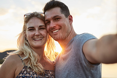 Buy stock photo Couple, selfie and sunset in nature for vacation, relax and travel with love, memory and leisure in California. People, portrait and happy for holiday, relationship and adventure with smile by lake