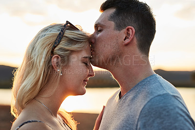 Buy stock photo Shot of a young couple spending the day outside