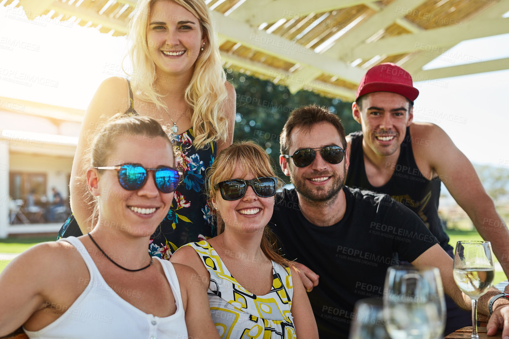 Buy stock photo Friends, hangout portrait and sunset drink outdoor for celebration, party and holiday together. Happy people, group and cheers for alcohol, festival or event on vacation or weekend in countryside