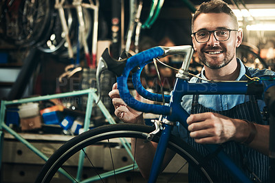 Buy stock photo Portrait, smile and repair man working in bicycle shop, store and cycling workshop from Canada with glasses. Face, bike mechanic and confident male person, professional and happy mature technician