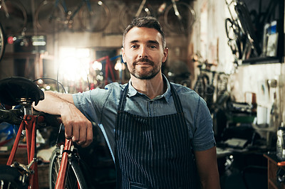 Buy stock photo Portrait, serious and repair man in bicycle shop working in store or cycling workshop. Face, bike mechanic and confident male person, business owner or mature professional technician from Australia.
