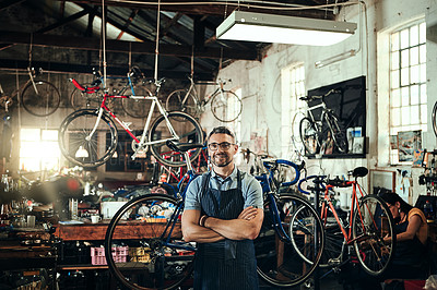 Buy stock photo Happy, portrait and repair man in bicycle shop with arms crossed in small business workshop. Owner, bike mechanic and smile of confident person, professional or mature technician and glasses in store