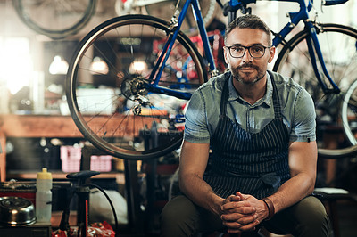 Buy stock photo Portrait, mechanic and man in bicycle shop, store and cycling workshop for repairs. Entrepreneur, bike technician and mature male person, small business owner and retail service expert from Canada 
