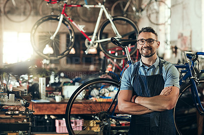 Buy stock photo Portrait, smile and repair man in bicycle shop with arms crossed working in store. Face, bike mechanic and confident male person from Canada with happiness, glasses and mature in cycling workshop.